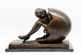 A 20th century cast bronzed model of a girl in high heels emerging from an egg at The Sculpture Park