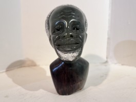 Small Head Man by Joel Masoka at The Sculpture Park