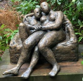 Embracing Couple on a Settee by Stella Shawzin at The Sculpture Park