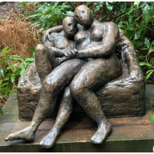 Embracing Couple on a Settee by Stella Shawzin at The Sculpture Park