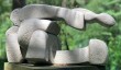 Abstract stone sculpture in three interlocking pieces by British School mid 20th century at The Sculpture Park