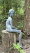Seated Girl by Brian Alabaster (lead) at The Sculpture Park 