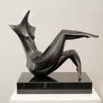 Isaac-Kahn-Born-1950-Lithuania-Reclining-Woman-Bronze-with-a-black-patina-Signed-and-Numbered-3-of-4-50-cms.-wide-bb-500x372