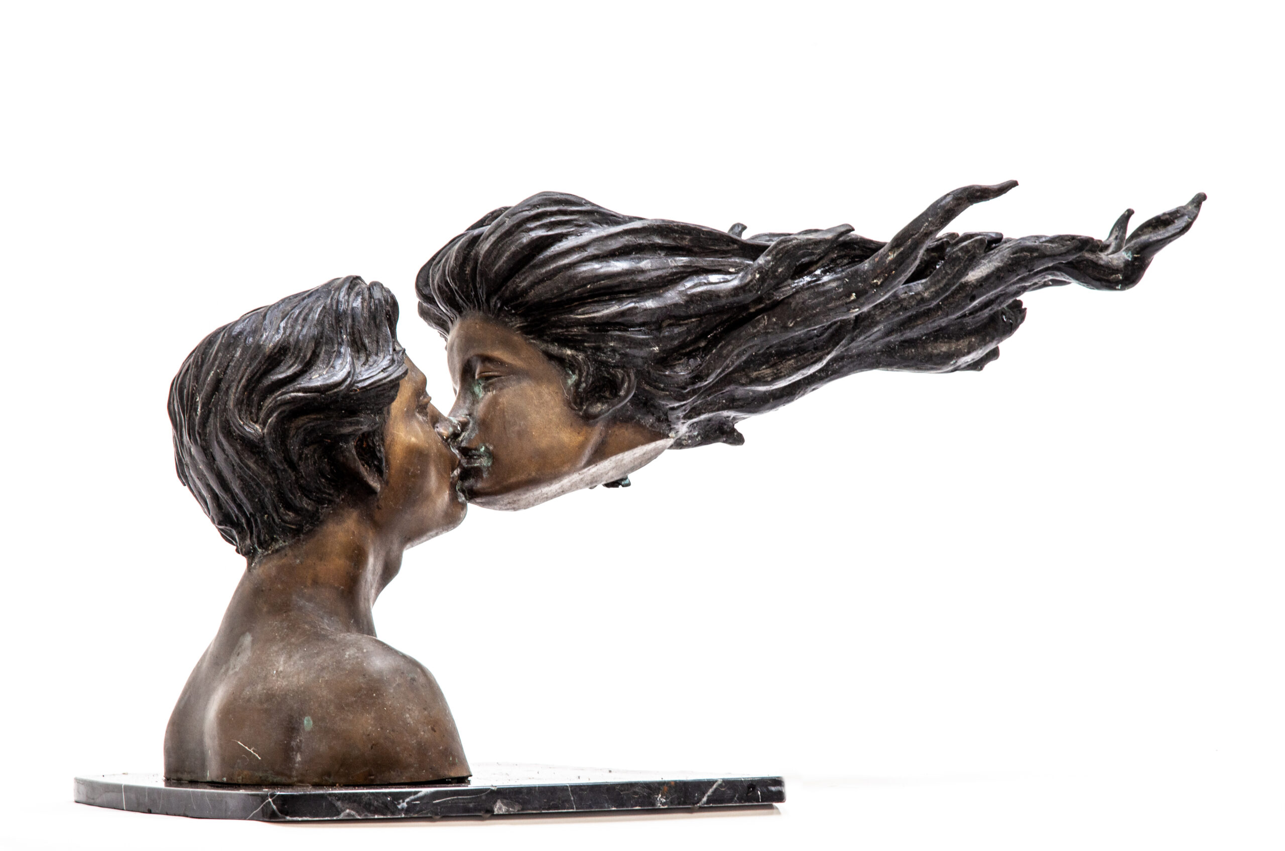 Boy and girl kissing sculpture